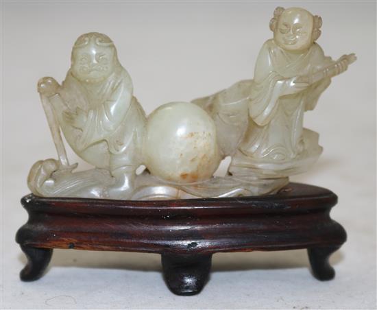 A Chinese pale celadon jade group of the immortals Li Tieguai and He Xiangu, 18th/19th century, 8cm, wood stand